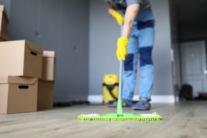 Close-up,Of,Professional,Cleaner,Washing,Floor,With,Green,Mop.,Man